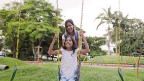 Family time, Happy mother and child having fun on swing set at kids park - Powered by Shutterstock - Get 15% off with code: PIKWIZARD15