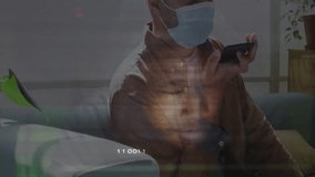 Using smartphone with digital binary code overlay, man wearing mask. Technology, cybersecurity, futuristic, protection, innovation, communication - Powered by Shutterstock - Get 15% off with code: PIKWIZARD15