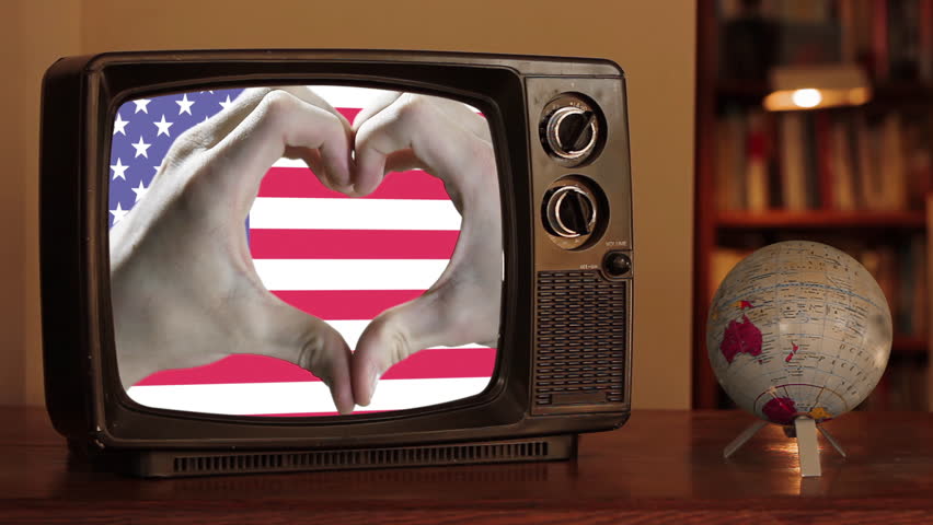 Hands Forming a Heart Shape Over the U.S. Flag on a Retro TV With a Spinning Globe - 4K - Powered by Shutterstock - Get 15% off with code: PIKWIZARD15