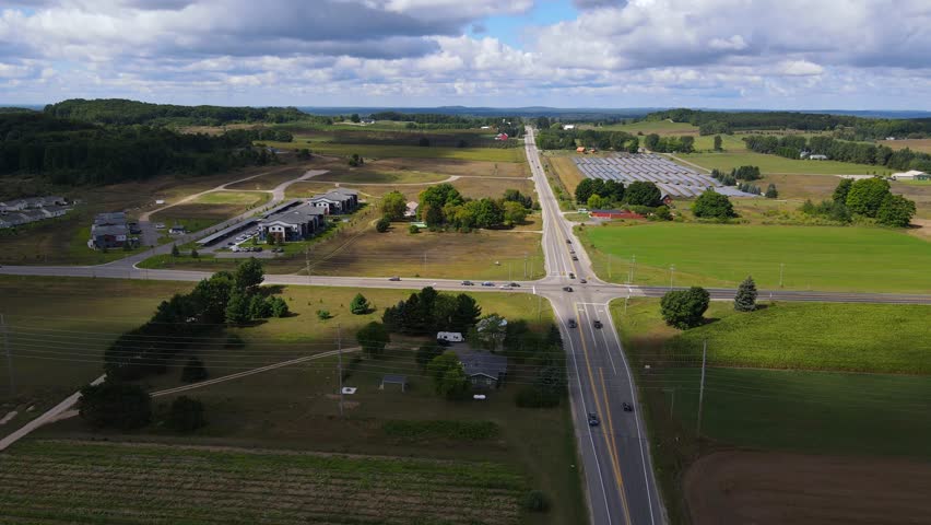 Road intersection and green landscape of Michigan, aerial view