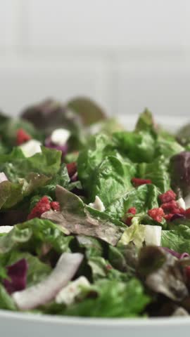 A high-quality 4K fresh salad promo featuring organic ingredients, crisp vegetables, and vibrant colors. Perfect for healthy food advertisements, restaurant promos, and diet-related commercials.