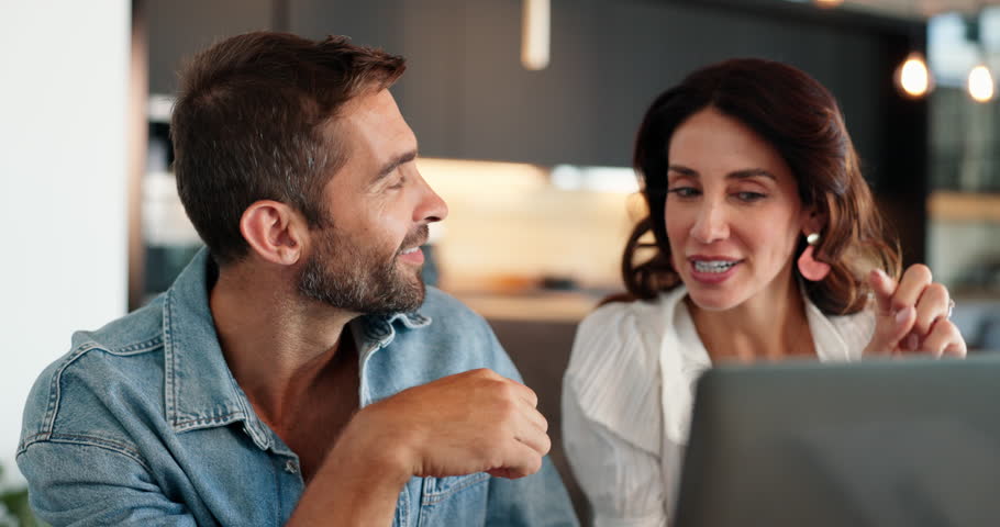 Laptop, support and planning with couple in kitchen for trading comparison, research and investment choice. Discussion, profit and stock app sign up with man and woman at home for asset management