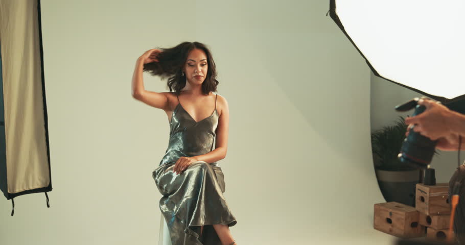 Smile, woman and photographer for photoshoot in studio, fashion campaign and production process. Model, posing and bts with photography catalog, magazine casting and filming set of creative industry