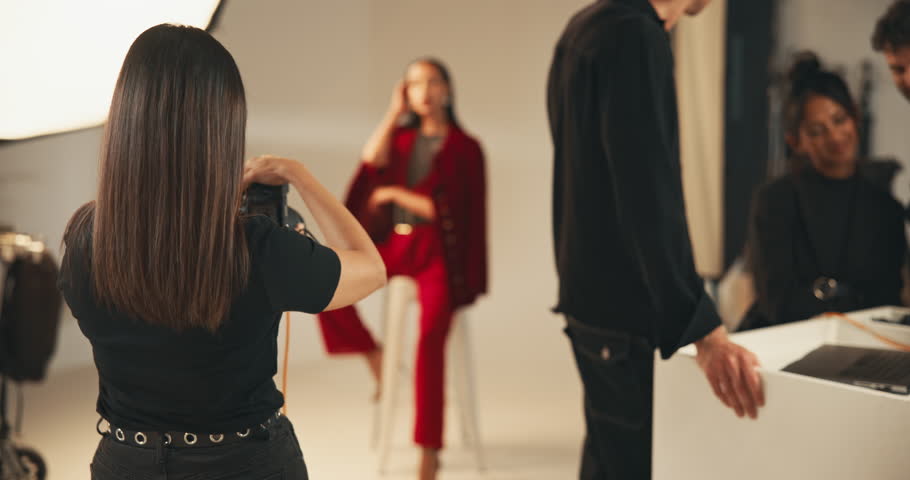 Photography, studio and woman model for filming photoshoot, backstage production and art. Media, people and camera equipment for creative project in workplace, capture image and process with flash