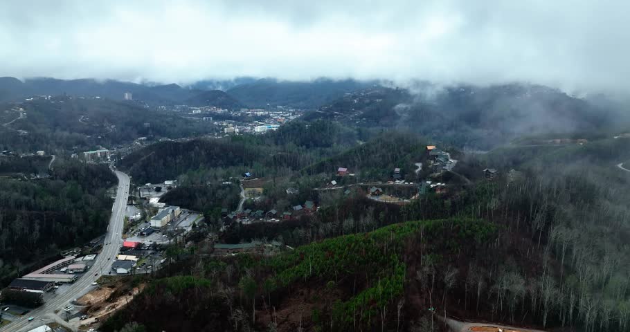 Drone view of the town of Gatlinburg, Tennessee during a foggy winter day