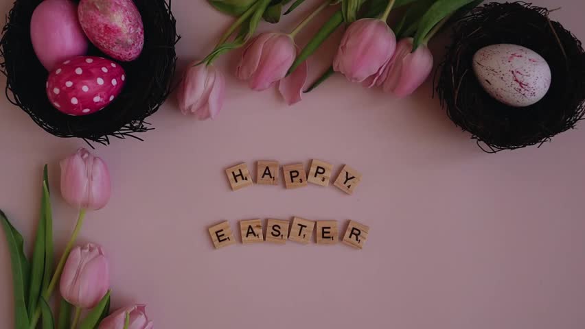 Elegant Easter celebration with pink tulips, decorative eggs, and scrabble tiles spelling 'Happy Easter'—aesthetic festive composition for spring joy!