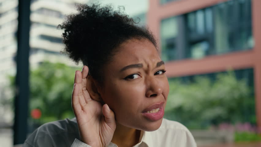 African American woman bad dont hearing quiet sound whisper female girl businesswoman portrait lady holding hand ear asking question deaf face listen health medicine business city outdoor gesture what
