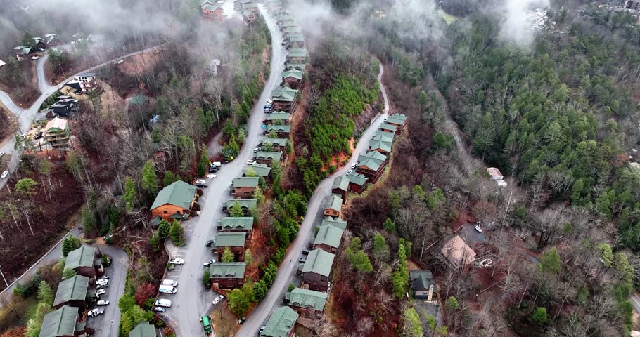 Drone view of cabins in Gatlinburg, Tennessee smoky mountains on a foggy day