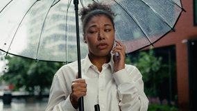 African American woman talk mobile phone smartphone boss employee upset female girl city call frustrated sad worried loss job problem business conversation outdoor businesswoman holding umbrella rain - Powered by Shutterstock - Get 15% off with code: PIKWIZARD15