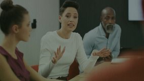 Business meeting discussion with binary code animation overlaying diverse team. technology, teamwork, collaboration, brainstorming, diversity, coding - Powered by Shutterstock - Get 15% off with code: PIKWIZARD15