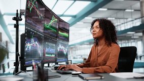 Stock Market Broker Looking At Graphs On Multiple Screens In Office - Powered by Shutterstock - Get 15% off with code: PIKWIZARD15