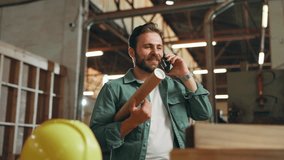 Carpentry, phone call and man for woodwork in workshop for furniture production, communication or contact. Construction, factory and person on mobile talking for timber order, lumber or manufacturing - Powered by Shutterstock - Get 15% off with code: PIKWIZARD15