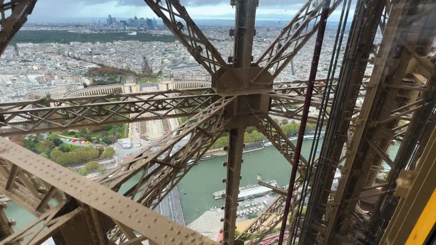 Ride in an Eiffel Tower (Tour Eiffel) elevator in Paris, France