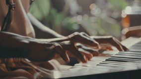 Hands of pianist pressing keys on acoustic piano with exposed internal mechanics, showing hammers and strings in warm sunlight. Close-up shot - Powered by Shutterstock - Get 15% off with code: PIKWIZARD15