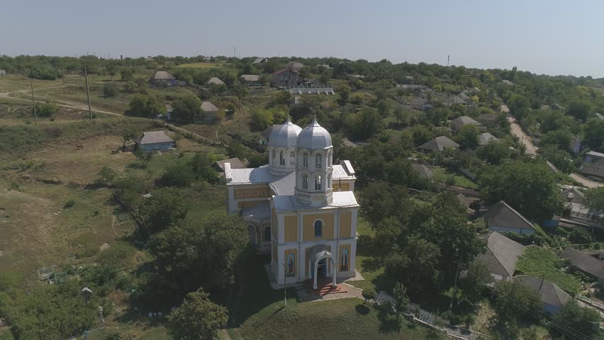 Golden Summer Light Illuminates a Moldovan Church Near the Dniester River – Drone Perspective
