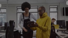 Collaborating in office, people with binary code animation overlay on screen. Business, teamwork, digital, technology, innovation, coding - Powered by Shutterstock - Get 15% off with code: PIKWIZARD15