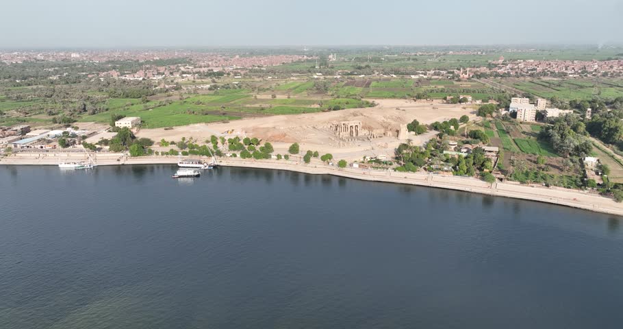 Egypt Aswan September 2023 : Aerial tour of Kom Ombo Temple: dual sanctuaries for Sobek  Haroeris, hieroglyphic carvings, and ancient sandstone columns under clear skies.