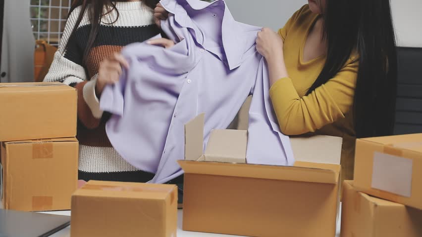 Portrait of Starting small businesses SME owners female entrepreneurs working on receipt box and check online orders to prepare to pack the boxes, sell to customers, SME business ideas online.