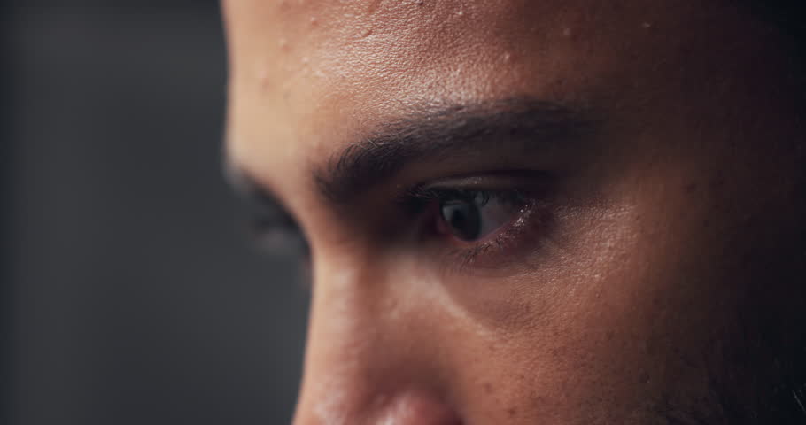 Thinking, eyes and man with idea closeup, insight or zoom on gray studio background. Vision, face and reflection with person planning decision, problem solving and serious with macro for mindset