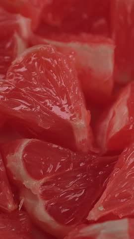 Fresh red grapefruit close up, rotation
