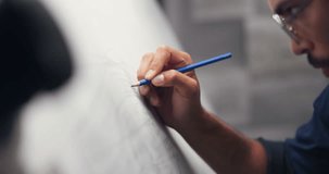 Architect, sketch and man with drawing at night for engineering design, blueprints and planning for urban project. Town planner, creative and person in dark with floor plan, ideas and illustration - Powered by Shutterstock - Get 15% off with code: PIKWIZARD15