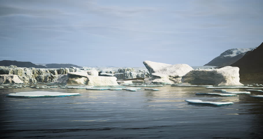 Icebergs float gently in calm waters, surrounded by distant mountains and cloudy skies, showcasing the beauty of a remote northern landscape at midday.