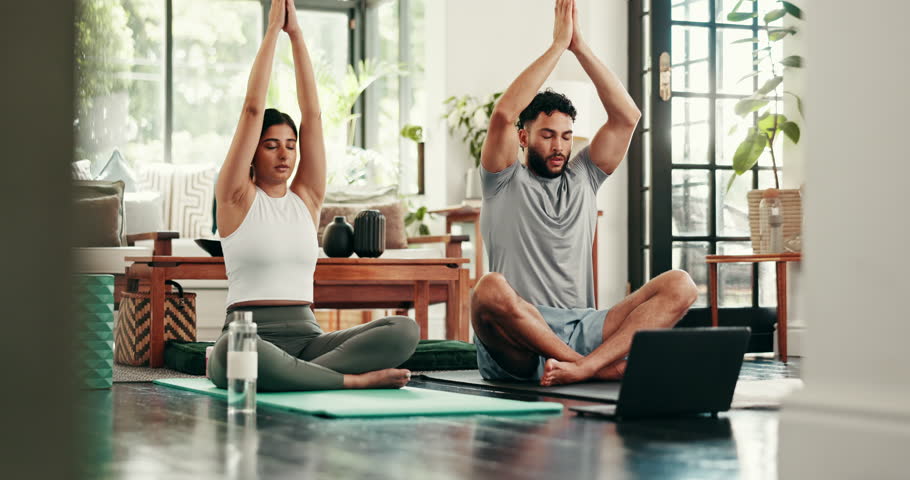 Yoga, laptop and couple breathe in home for mindfulness, online meditation and wellness. Morning, house and man with woman on computer for video tutorial, health subscription and lesson with namaste
