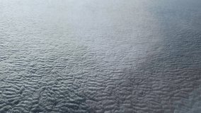 Dense layer of cumulus clouds, top view from an airplane side window during a flight at high altitude above of the clouds
 - Powered by Shutterstock - Get 15% off with code: PIKWIZARD15