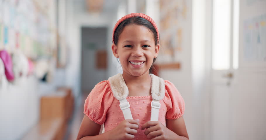 Education, happy and face of girl at school for learning, knowledge and future. Child development program, studying and growth with kid in hallway of Stem academy for students, classroom and youth