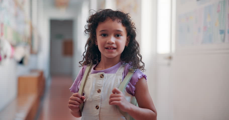 Education, smile and face of girl at school for learning, knowledge and future. Child development program, studying and growth with kid in hallway of Stem academy for students, classroom and youth