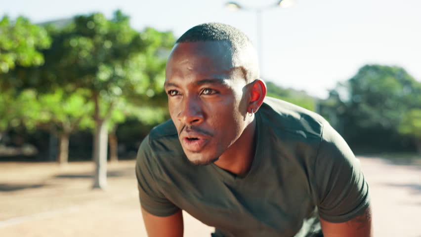 Breathe, break and black man with fitness in nature for sports, exercise and training for marathon. African athlete, tired and exhausted from workout with sweat, run fatigue and cardio in park
