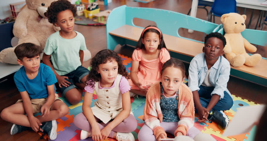 Education, answer and group of children, learning and teacher with questions in classroom or school. Elementary, students and teaching kids for knowledge, growth and development with quiz or lesson