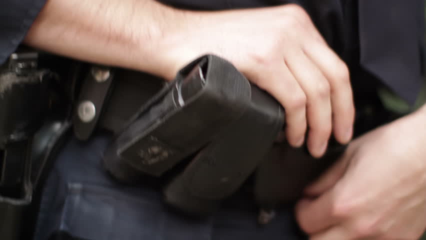 Details of a New York City policeman's belt. Hand held camera on the streets of