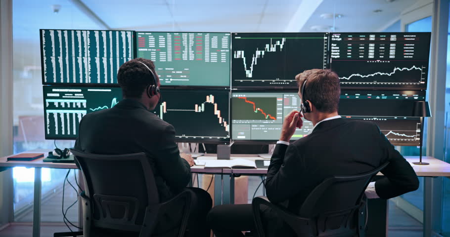 Men, graphs and computer screen for trading, advice and headset with stats, analysis and problem solving. People, partner and monitor for charts, stock market and discussion at investment agency