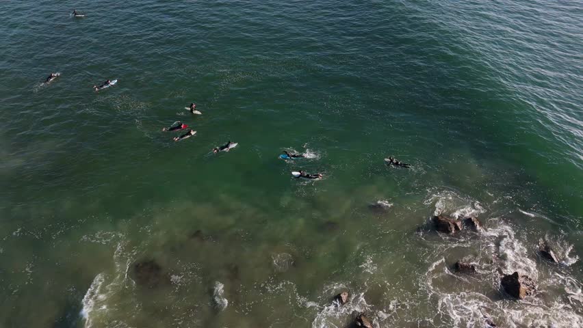 Surfers Waiting for Waves in Clear Water - Aerial View of Venice Beach
