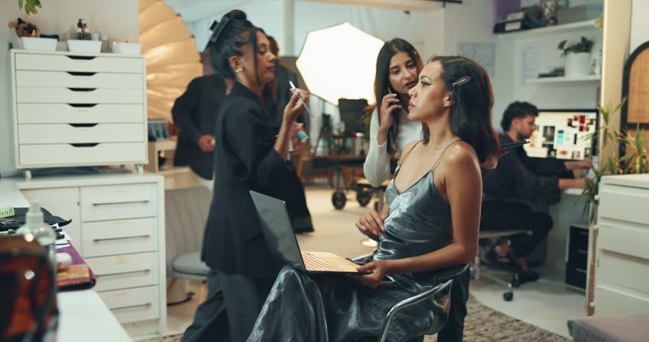 Model, woman and production in studio for photoshoot, interview or fashion choice. Behind the scenes, influencer and phone call in media agency for busy schedule, cosmetology or creative industry
