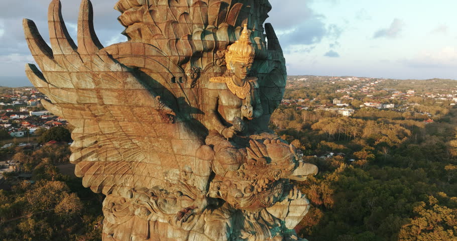 Bali, indonesia. Drone Aerial view 4k Statue of Vishnu in Garuda Wisnu Kencana Cultural Park at sunrise. Bali's Most Iconic Landmark Hindu God Garuda Wisnu Kencana, Bali, indonesia.
