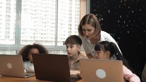 Smart teacher teaching and looking student using laptop at classroom. Professional instructor explained about programing engineering code or prompt while studying and learning program. Erudition. - Powered by Shutterstock - Get 15% off with code: PIKWIZARD15