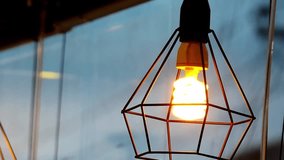 Illuminating Design: Modern geometric pendant lights hang indoors, showcasing an industrial aesthetic with Edison bulbs casting a warm inviting glow.  - Powered by Shutterstock - Get 15% off with code: PIKWIZARD15