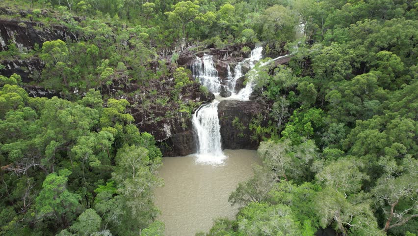 Spectacular aerial footage of Cedar Creek Falls near Airlie Beach Queensland Australia