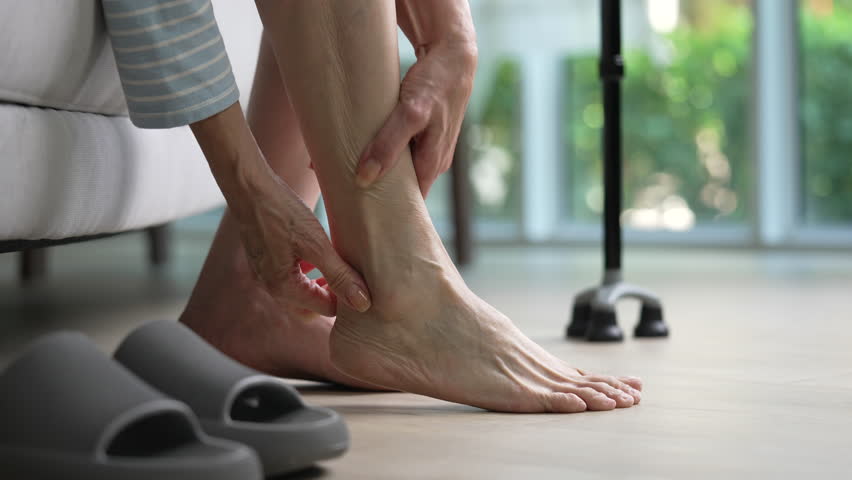 Senior woman suffering from pain in ankle and foot