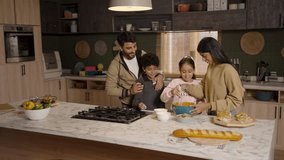 A joyful family—father, mother, son, and daughter—gather in the kitchen, happily baking together and creating cherished memories. - Powered by Shutterstock - Get 15% off with code: PIKWIZARD15