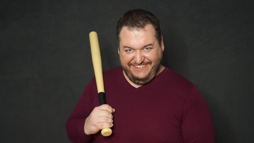 A grown man scares people on Halloween.