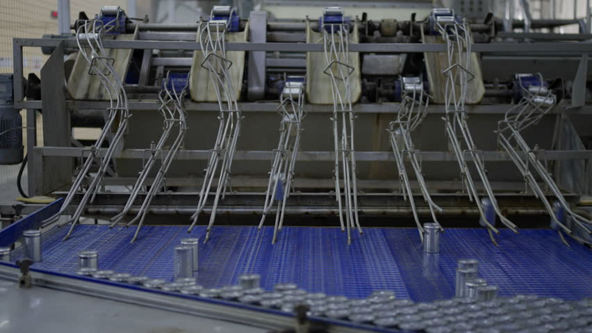 Line production of canned fish factory. Factory and machinery.
