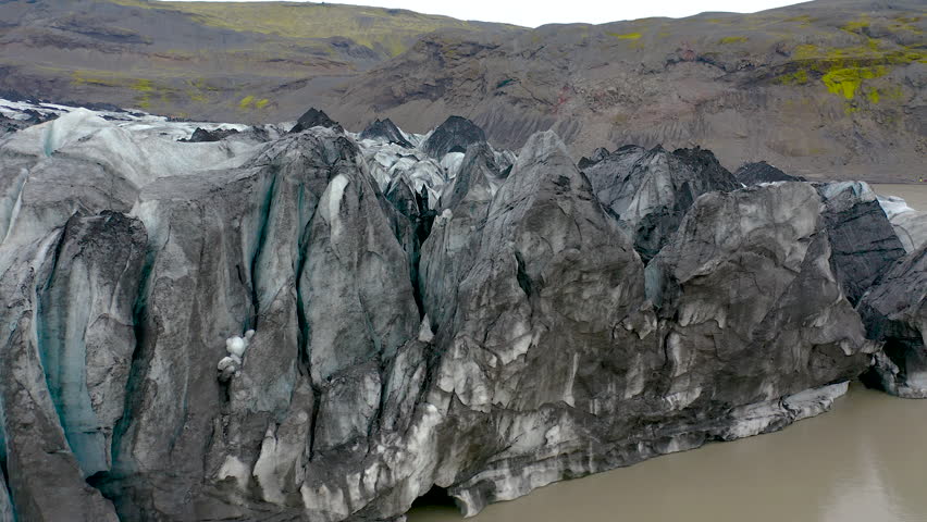 Aerial view of icebergs cliffs in the Solheimajokull glacier lagoon in southeast Iceland.
