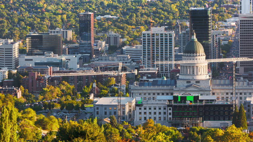 Utah State Capitol and Salt Lake City skyline with panning motion. Salt Lake City, is the capital and most populous city of the U.S. state of Utah