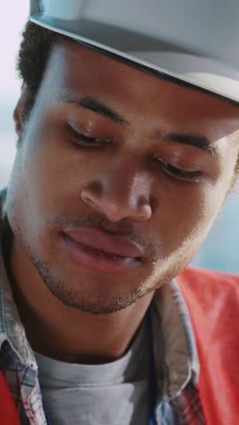 young inspired male architect african maerican foreman engineer drawing new deisgn of civil construction inside office.