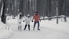 Young parents are skating on ice in middle of park, holding hands with their teenage son. They are chatting and smiling, and seem to be having great time. - Powered by Shutterstock - Get 15% off with code: PIKWIZARD15