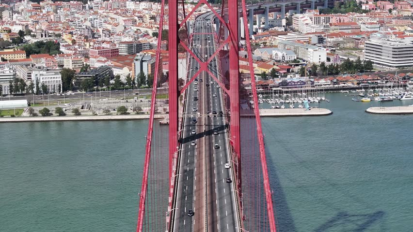 25 Of April Bridge At Lisbon In Lisbon District Portugal. Infrastructure Scenery. Road Trip Transportation. 25 Of April Bridge At Lisbon In Lisbon District Portugal. Famous Cable Stayed Bridge.