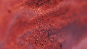 Sparkle paint fluid. Gel shadows. Shiny fluid. Defocused red color shimmering sequin particles flicker in water liquid emulsion spill abstract art background with bokeh lights. - Powered by Shutterstock - Get 15% off with code: PIKWIZARD15